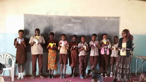 Children from Zambian school with Dernier Publishing books