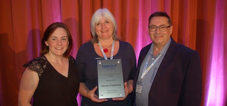 Janet Wilson of Dernier Publishing, accepting the Accessible and Inclusive award from Torch Trust.
